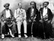 Tanzania / Zanzibar: Tippu Tip, Tippoo Tip or Tippu Tib, East African slaver, businessman and warlord (1837-1905, right), with British colonial official and Zanzibari Arab dignitaries